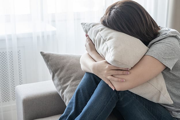 a woman crying as she realizes she has a Substance Abuse problem