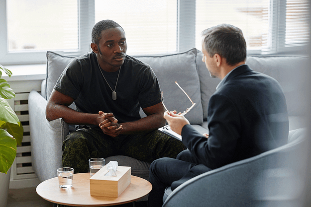 A veteran and a therapist discuss symptoms of PTSD in veterans