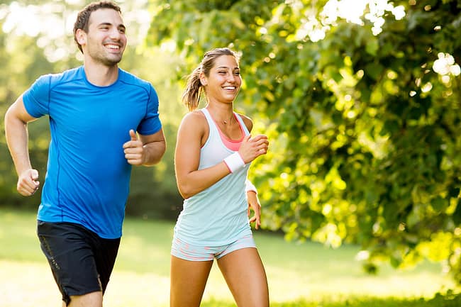 Man and woman use jogging as a method for how to stay sober