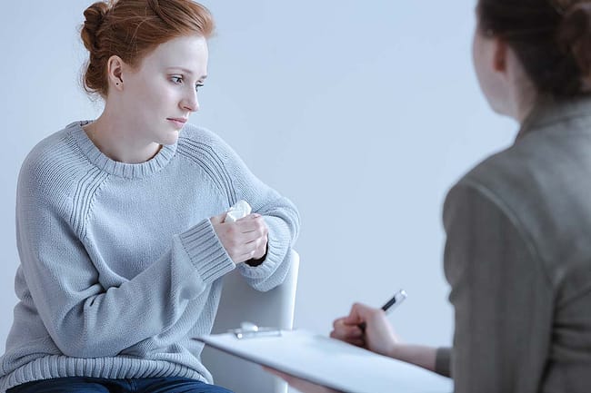 a woman talking to her doctor about how to stop isolation