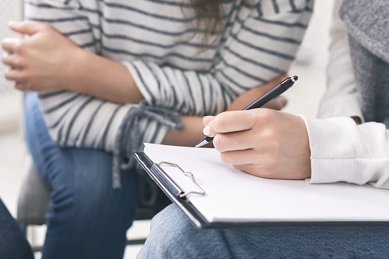 patient filling out form to quit using heroin