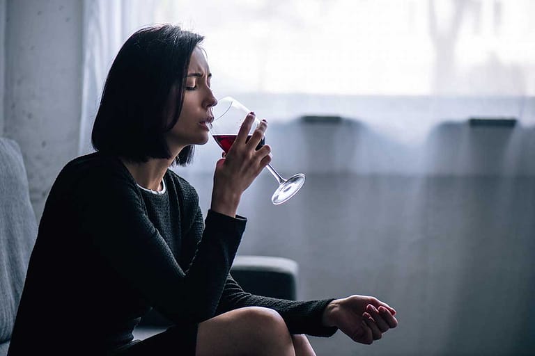 woman considers the connection between addition and alcoholism