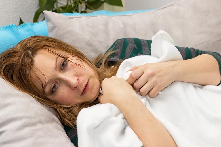 woman laying on couch