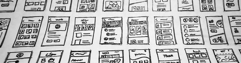 Black and white sketched wireframe showing accessible web design layout with clear headings, buttons, and navigation structure.