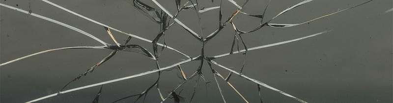 Shattered glass as a metaphor for reputation under pressure for healthcare organizations. Even the smallest cracks in your strategy can spread and affect patient trust long before a PR crisis happens