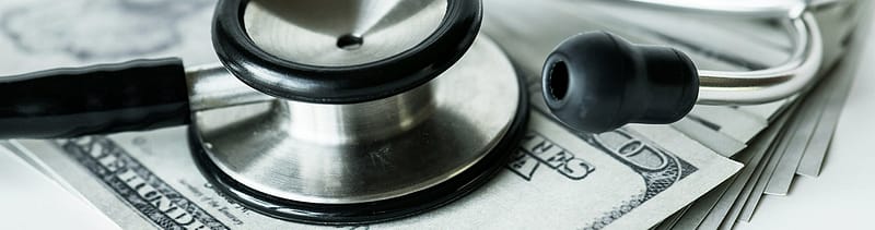stethoscope on top of money