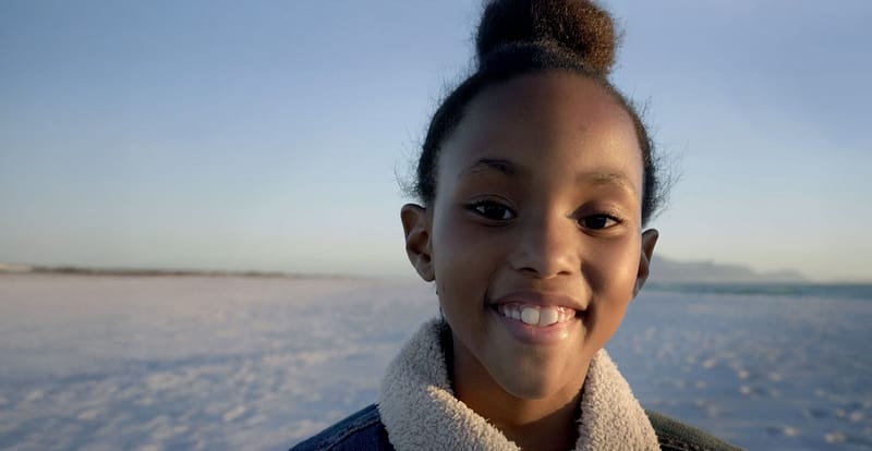 Young girl smiling into the camera