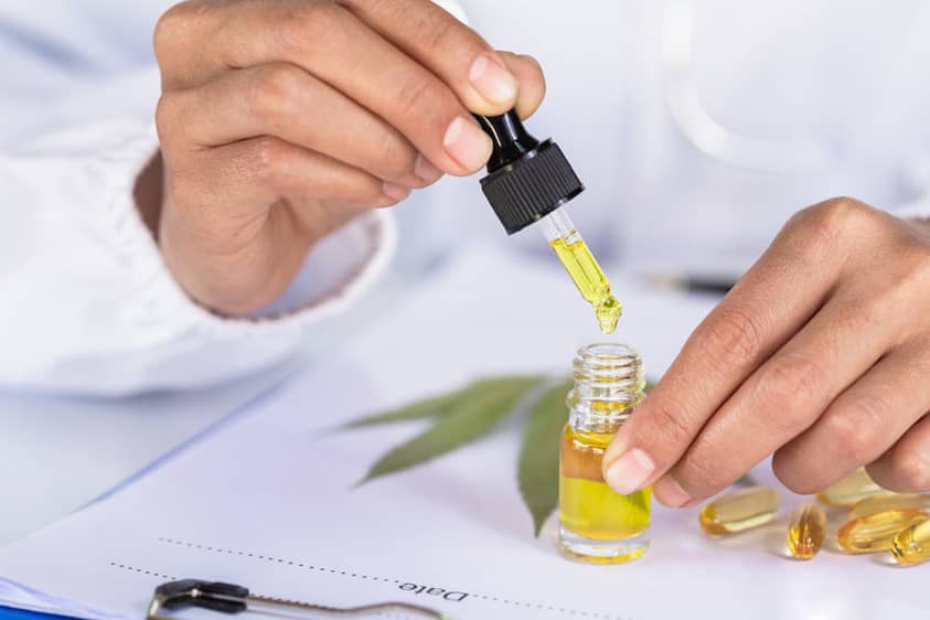 A doctor researching CBD oil in a lab.