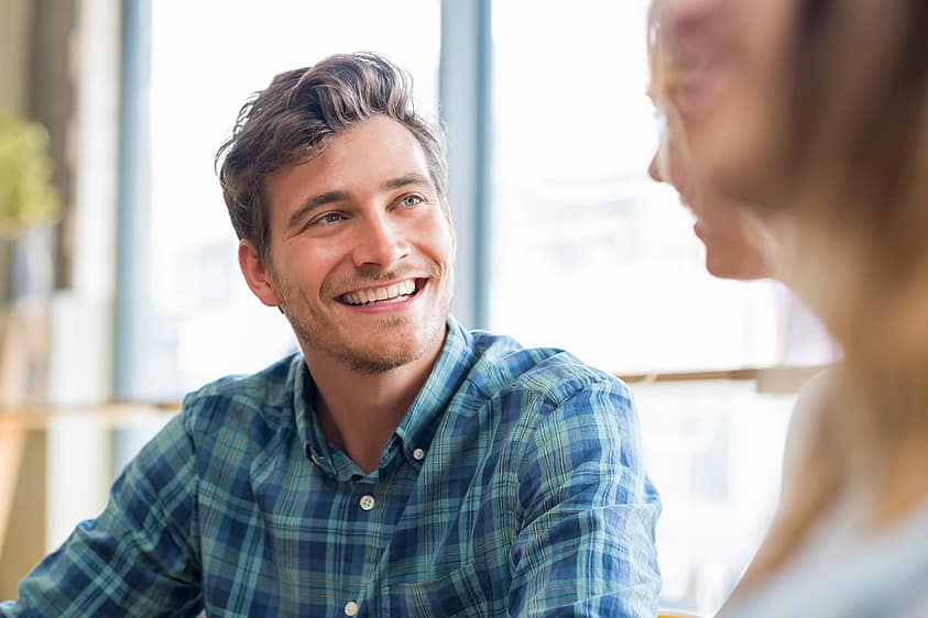 Man smiling as he learns tips for staying sober