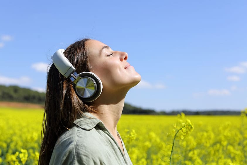 a woman with headphones wonders what is biosound therapy
