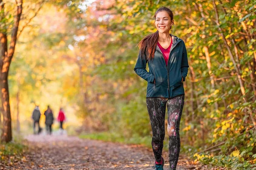 a person takes a lovely autumn walk while living life after rehab