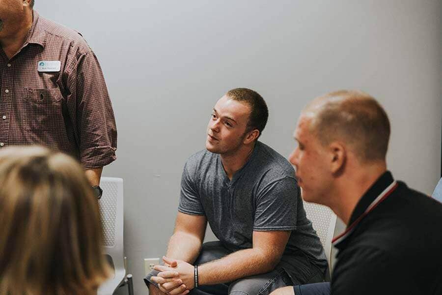 Patient listening intently during partial hospitalization program or PHP