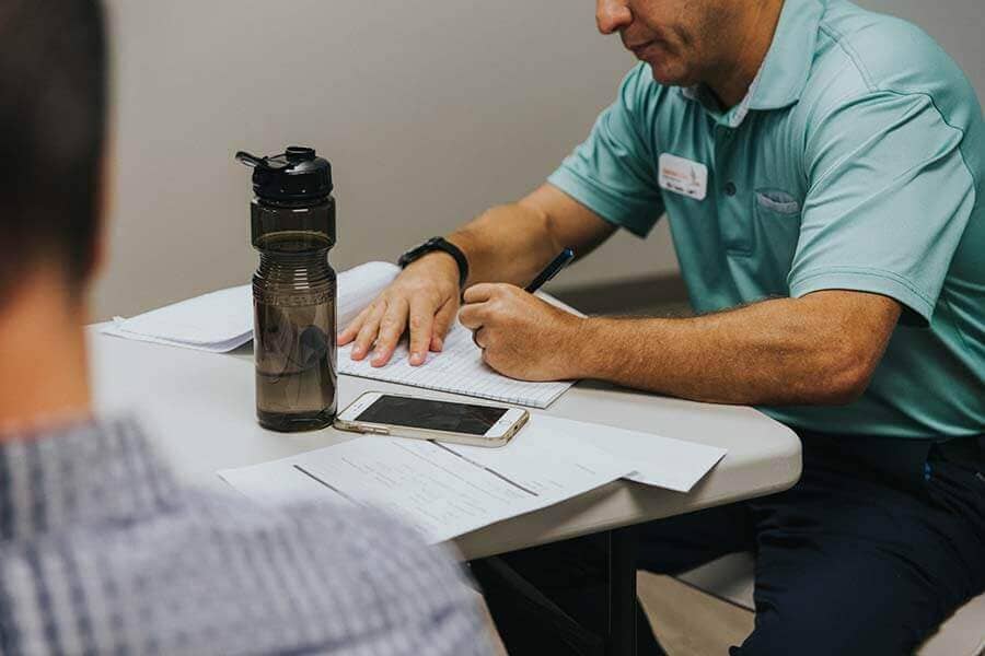 Beaches Recovery Therapist taking notes during a Drug Rehab Therapy Session