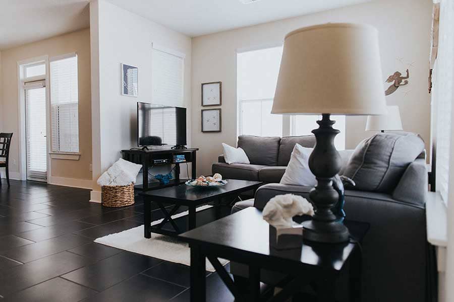 Close-up of Living space in residential program area with Lampshade in foreground and sofas in background