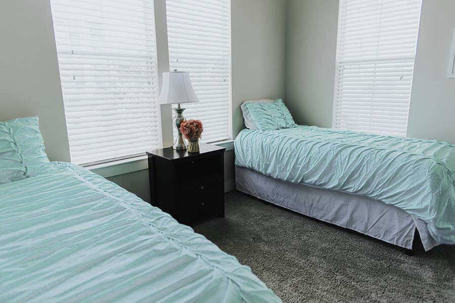 Beds in Bedroom of residential program apartment at Beaches Recovery