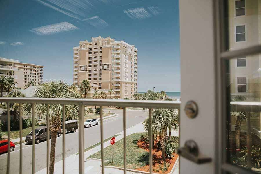 View of the beach from the balcony of a drug rehab house