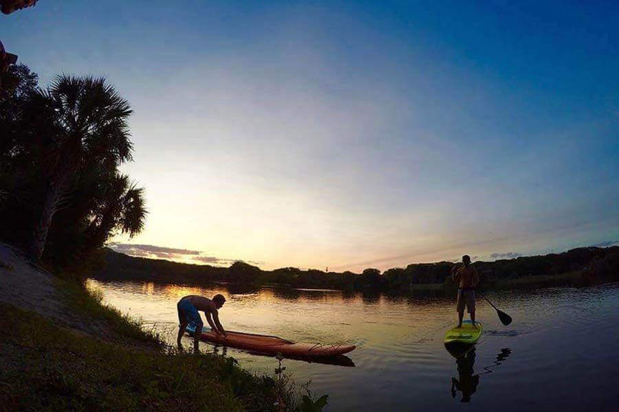 Two Paddle Boarders at sunset