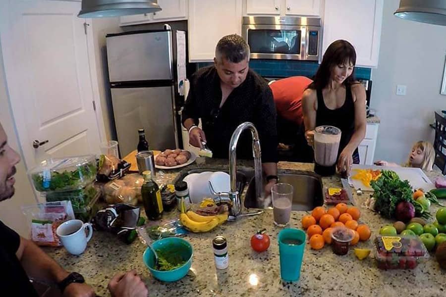 Patients in a drug rehab home working together to make dinner