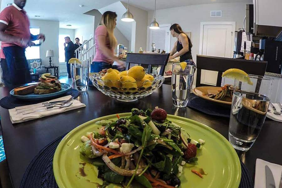 Patients in a drug rehab home working together to make dinner