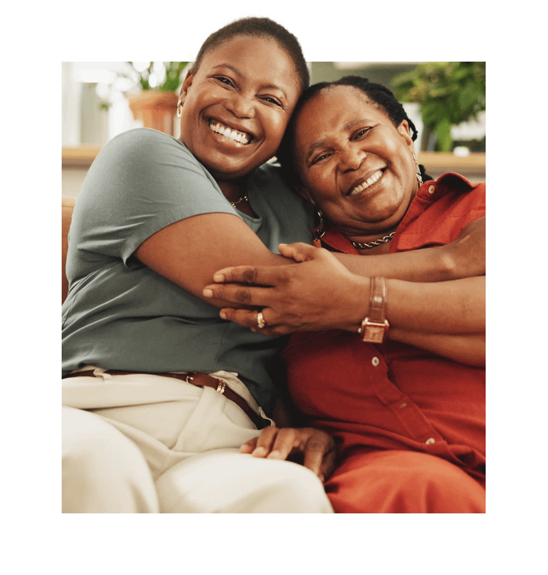 Senior smiling and hugging woman