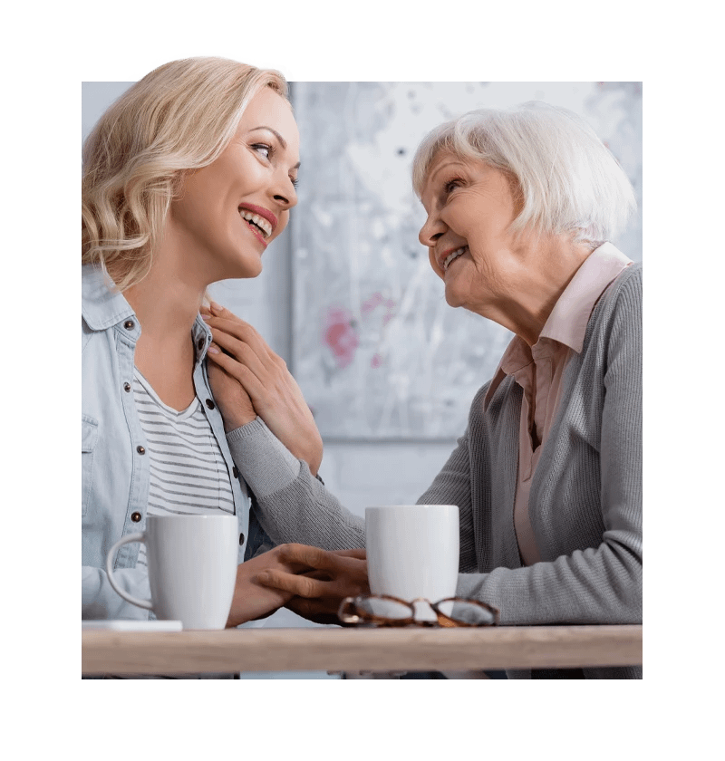 Senior having tea with woman