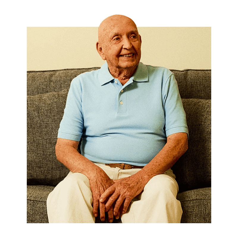 Senior smiling on couch