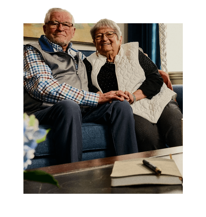 Seniors sitting together on couch